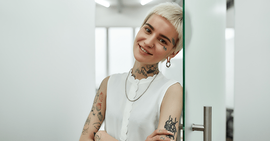Young woman with tattoos.png Short-haired young woman with tattoos