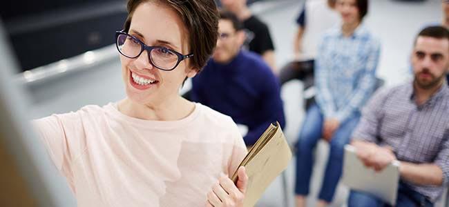 Outplacement Coders Lab A happy teacher with students